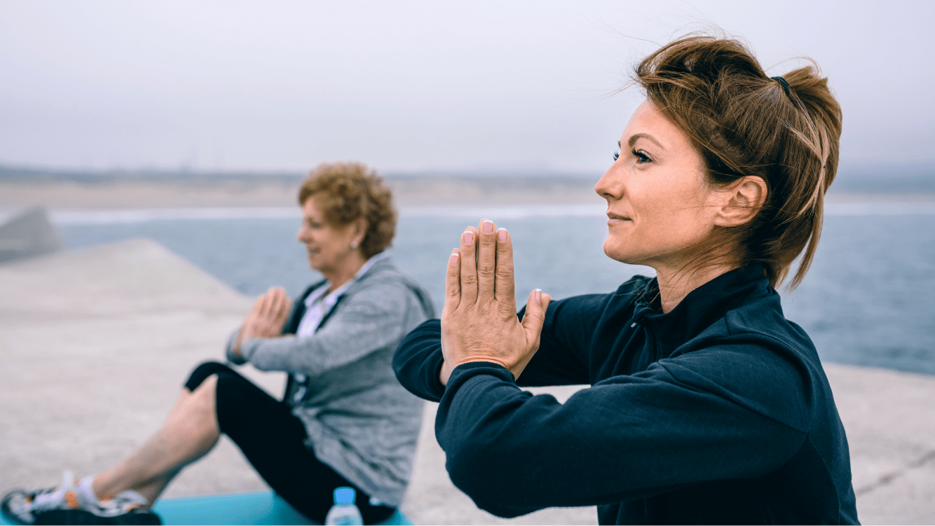 two ladies doing yoga