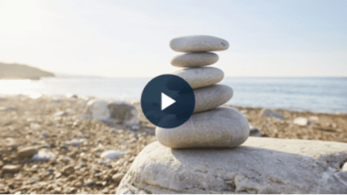 Stacked balanced stones on a beach