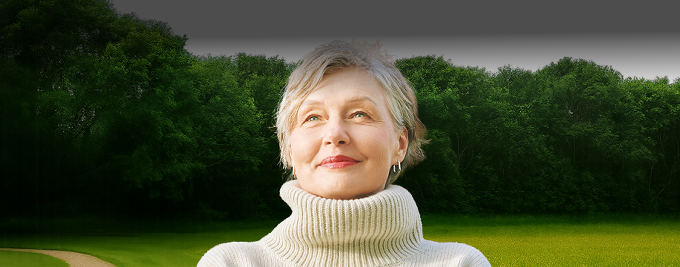 Smiling senior woman in a park.