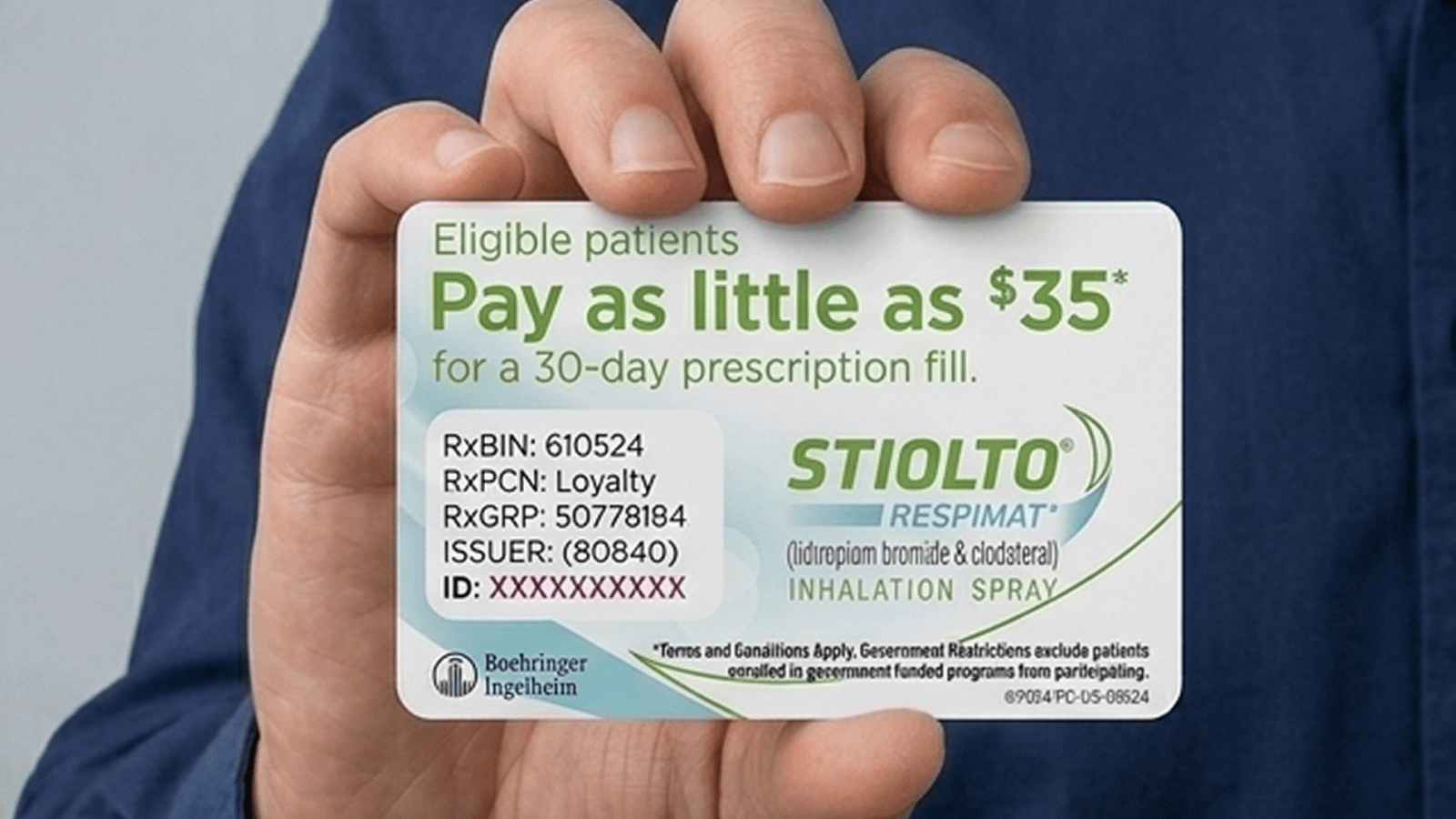 A hand holding a Stiolto Respimat savings card.